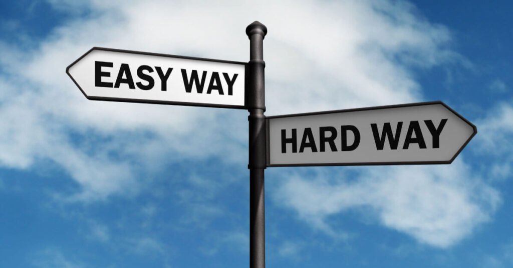 Cross Roads signs that read easy way and hard way