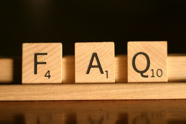 the letters f a and q on scrabble pieces