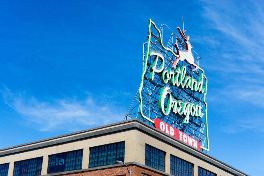 portland oregon old town sign on top of building