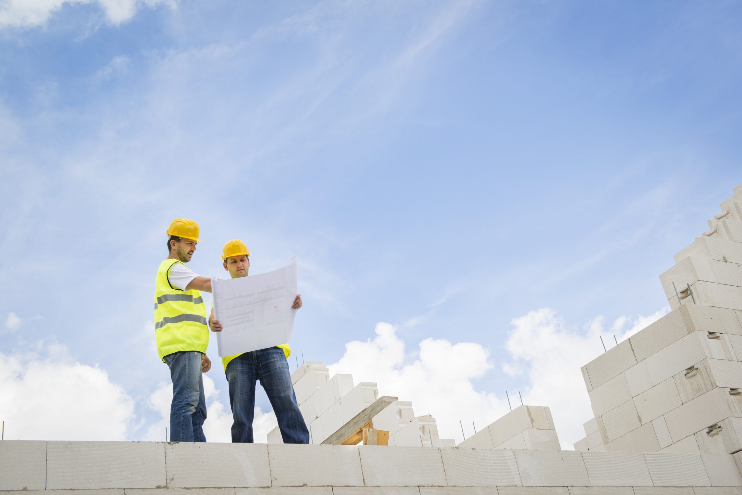 Utah Contractors Going Over House Construction Plans
