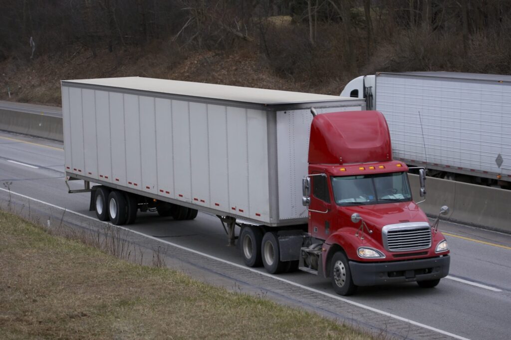 freight trucks passing each other on highway