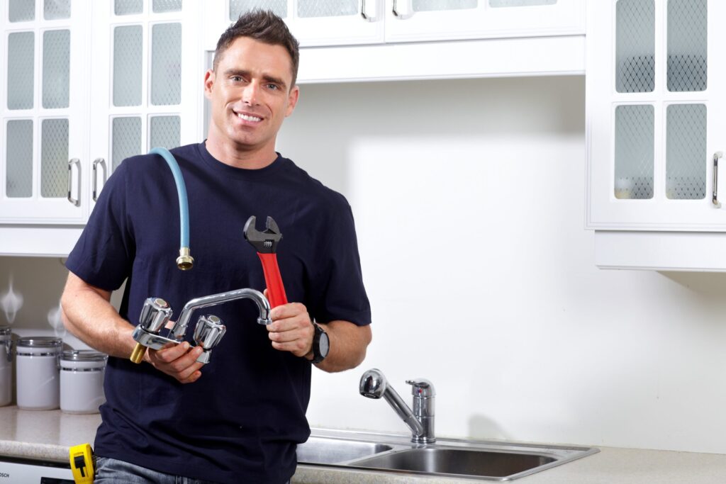plumber holding tools in hands