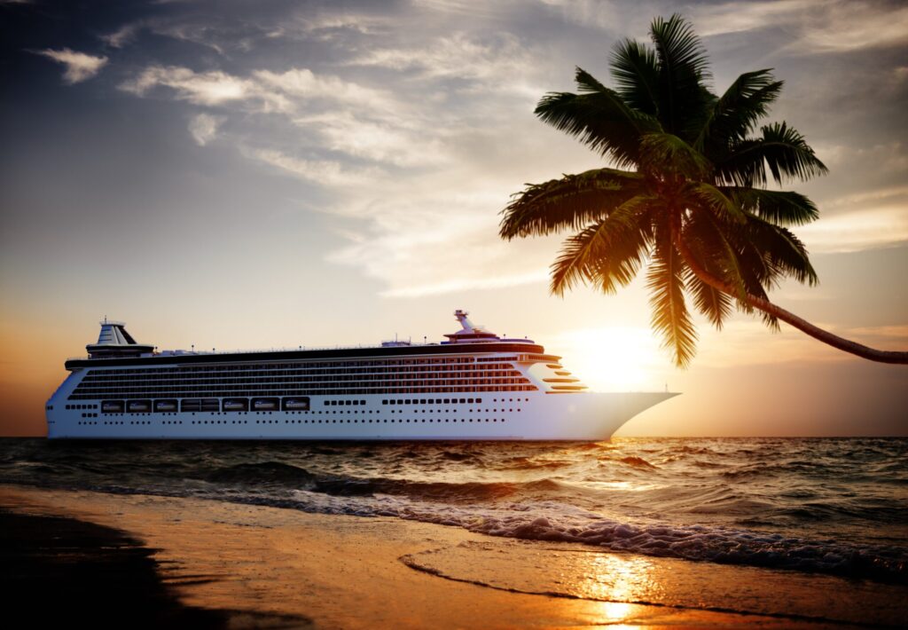 cruise ship on ocean with palm tree on beach