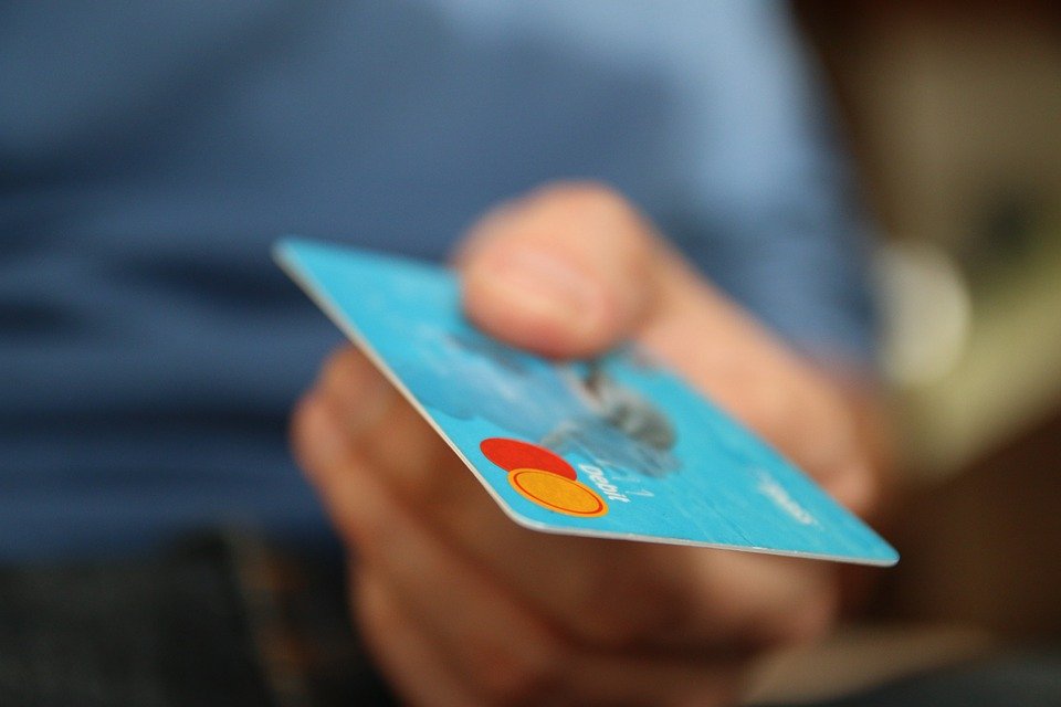 Man Holding Credit Card