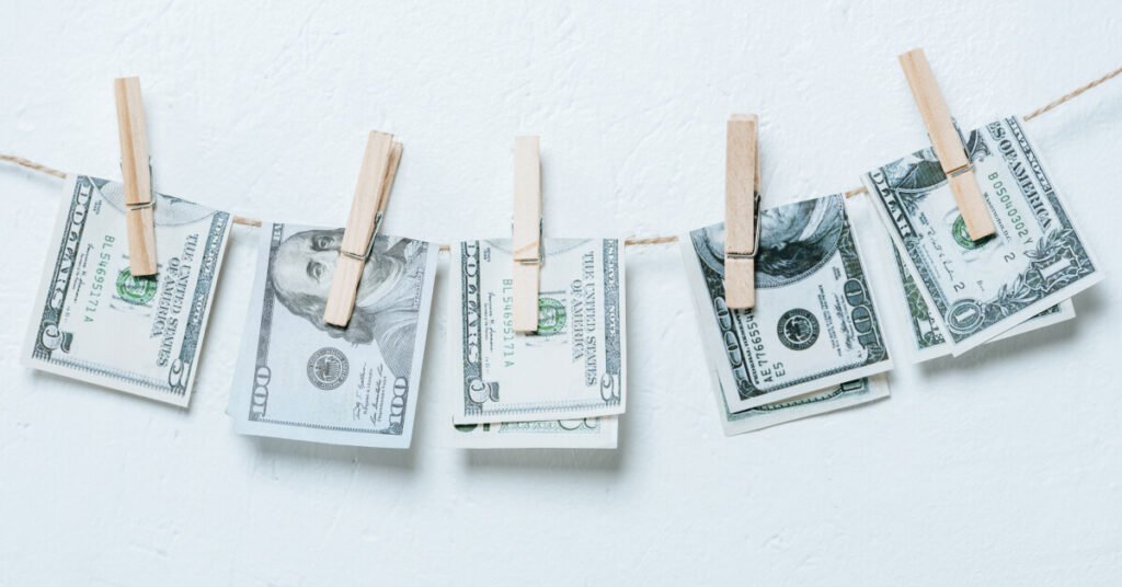 money attached to line with clothespins