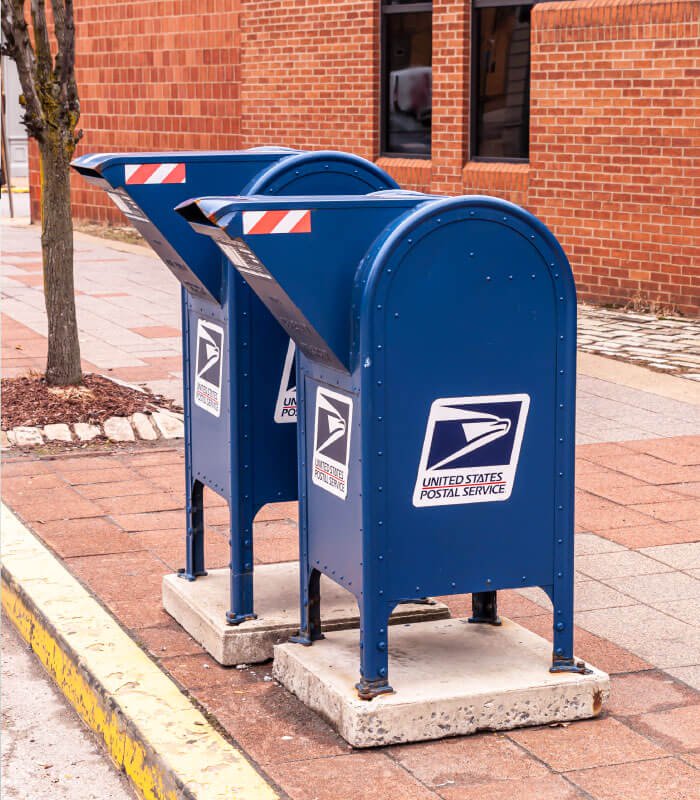 unite states postal service mailboxes on sidewalk
